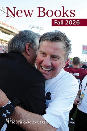 Close-up of coach Steve Spurrier hugging a man in celebration after football game win.