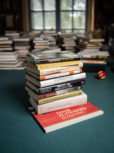 stack of books on pool table